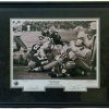 This famous, professionally framed photo by John Biever depicts the famous "Ice Bowl" game of New Years Eve 1967, where the Green Bay Packers defeated the Dallas Cowboys for the NFL Championship.